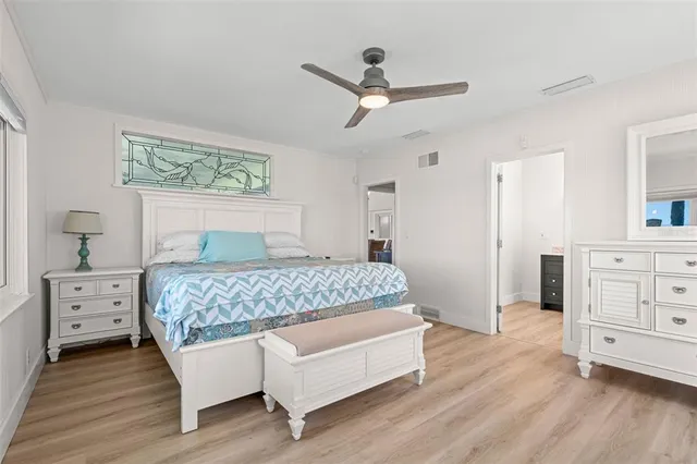 a bedroom with two beds and a couch