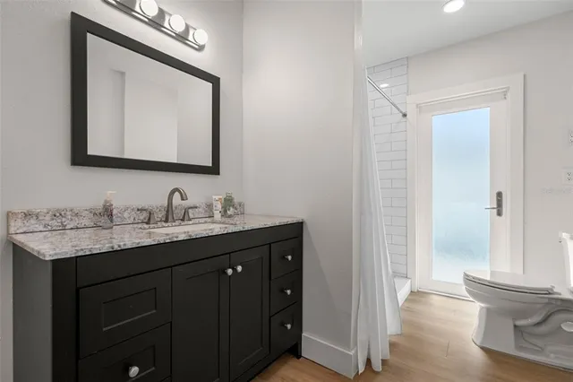 a bedroom with a bed and a lamp