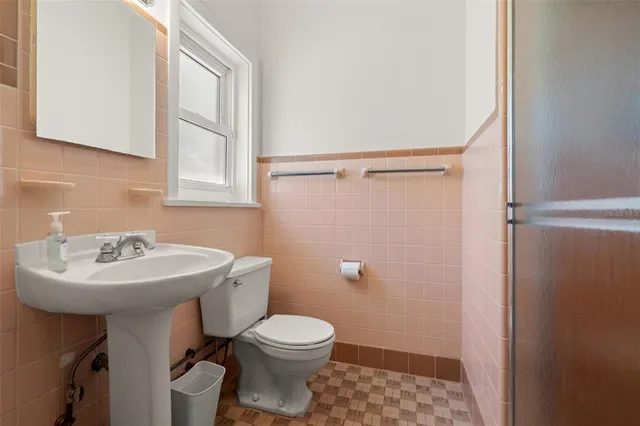 a view of a patio with a table and chairs under an umbrella