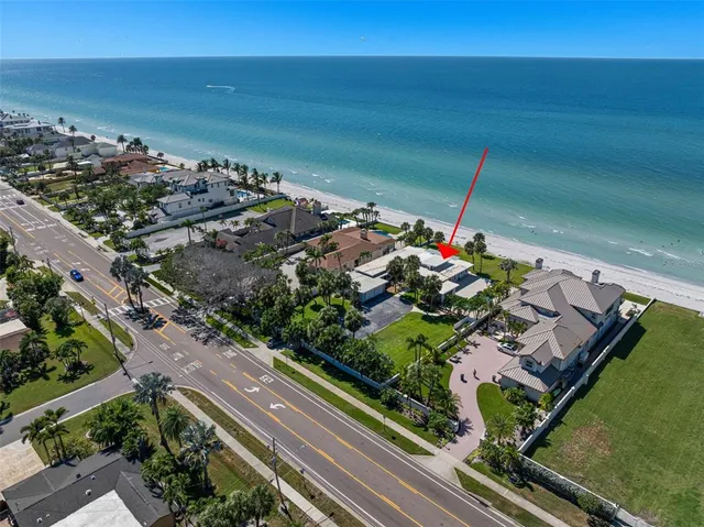 a kitchen with stainless steel appliances a refrigerator sink and cabinets