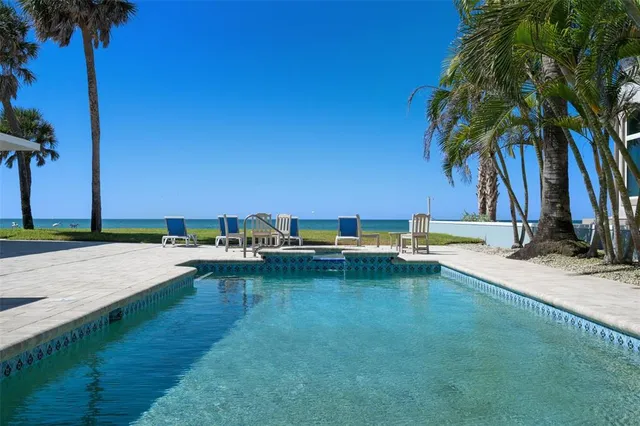 a view of a swimming pool with a yard