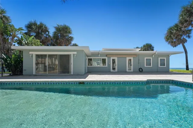 a view of swimming pool with outdoor seating