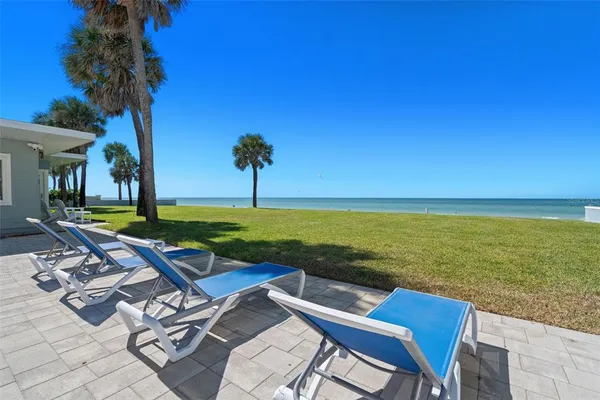a view of a yard with an outdoor seating