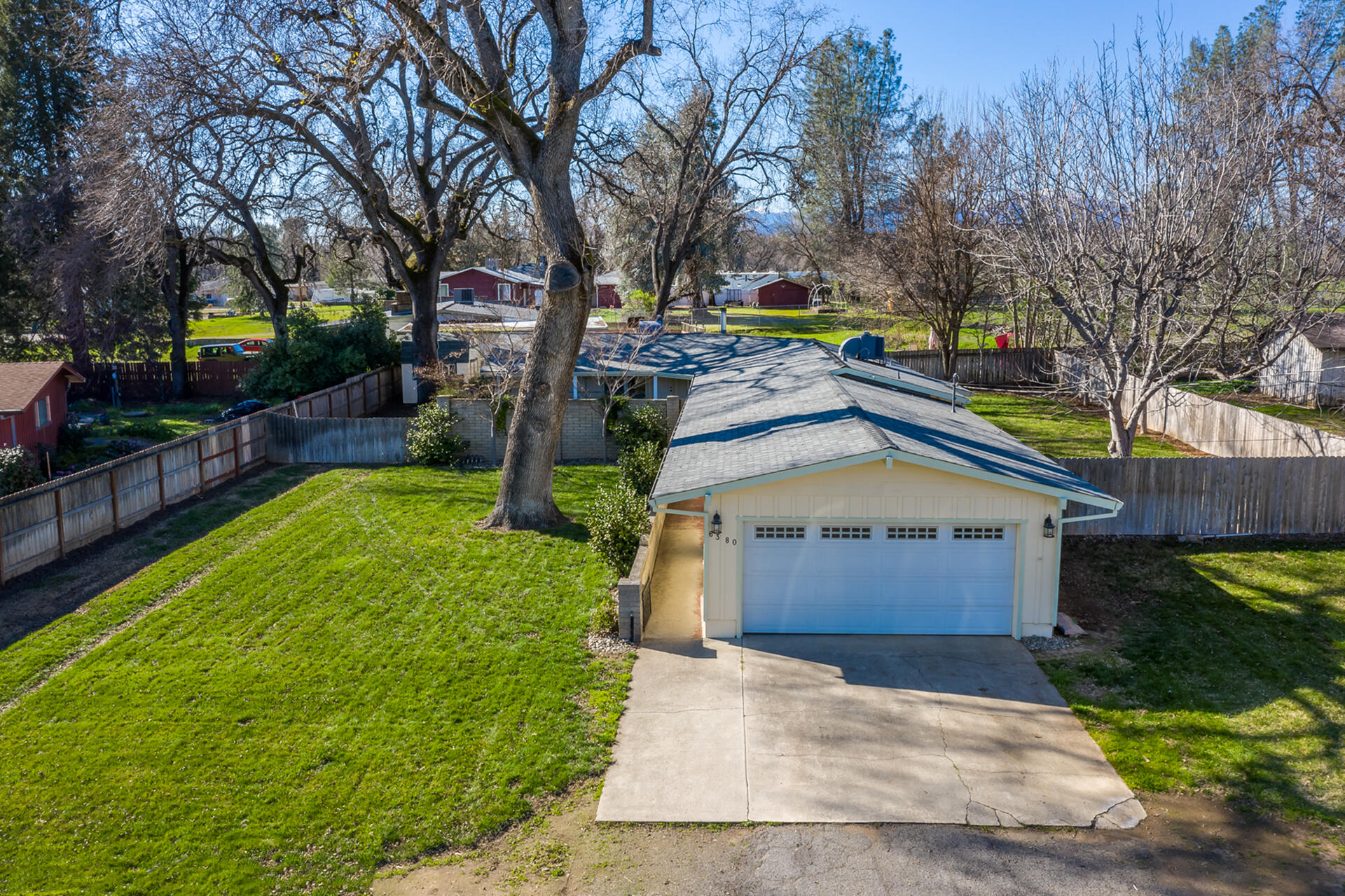 6380 Riverside Drive Redding, CA 96001 - Photo 38 of 46 a front view of a house with a yard and a garden