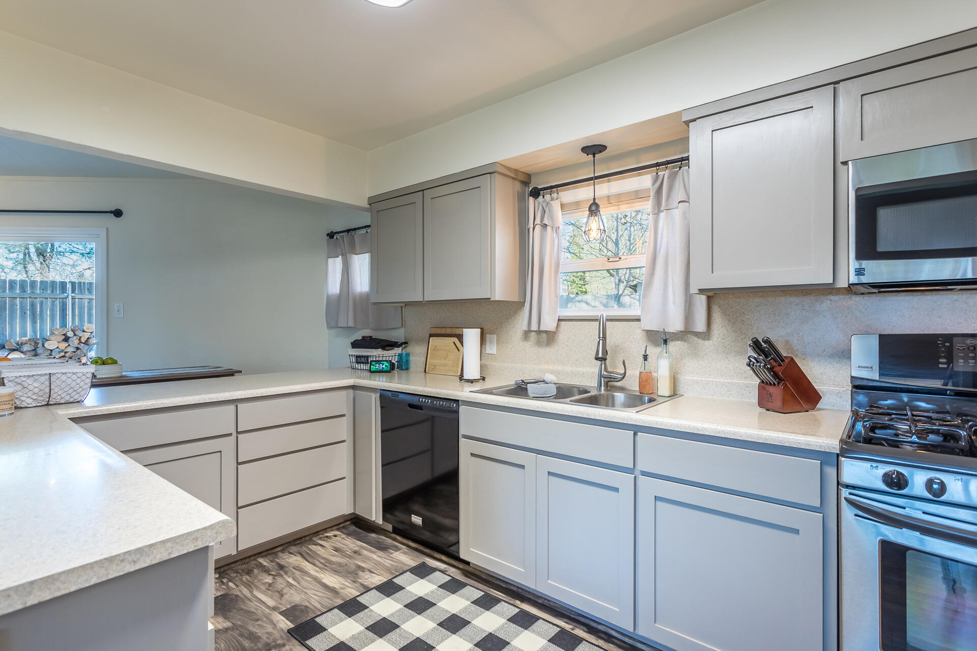 6380 Riverside Drive Redding, CA 96001 - Photo 9 of 46 a kitchen with a stove a sink and a microwave