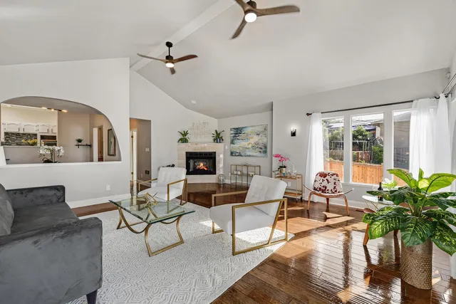 a living room with furniture and a fireplace