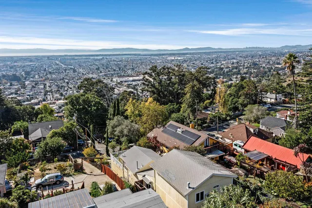 a view of a chairs and table in the balcony