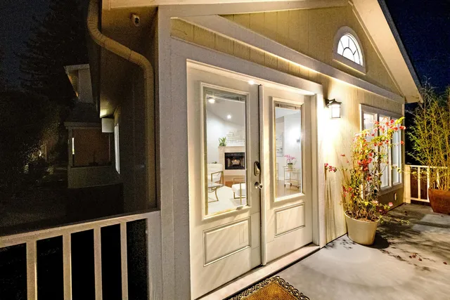 a view of a roof deck with couches and sky view