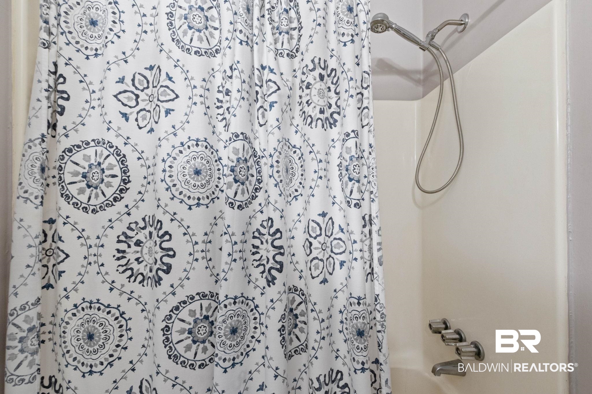 5366 Scanlan Way West Satsuma, AL 36572 - Photo 26 of 43 Bathroom featuring shower / bath combo with shower curtain