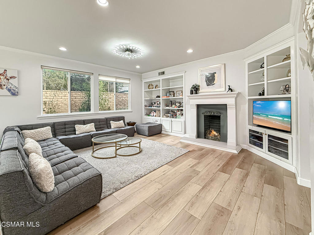 5816 Painted Pony Circle Simi Valley, CA 93063 - Photo 12 of 46 a living room with furniture flat screen tv and a fireplace