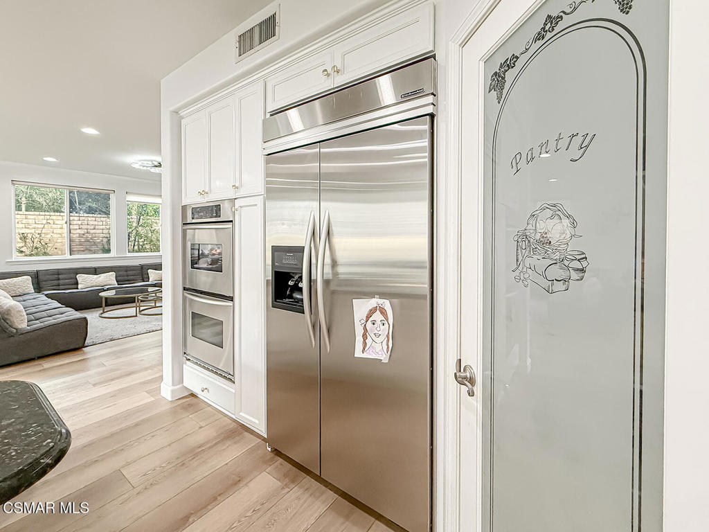 5816 Painted Pony Circle Simi Valley, CA 93063 - Photo 16 of 46 a kitchen with stainless steel appliances granite countertop a refrigerator and a stove