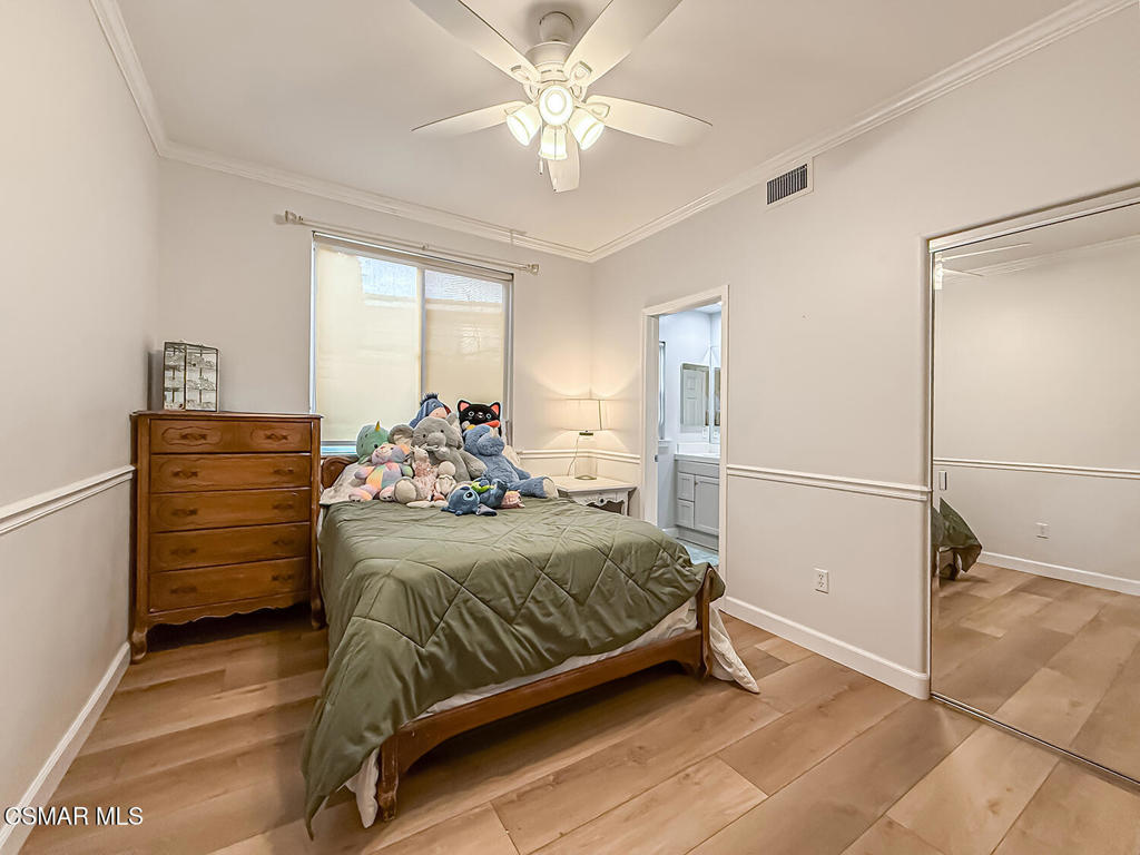 5816 Painted Pony Circle Simi Valley, CA 93063 - Photo 18 of 46 a bedroom with a bed and a refrigerator