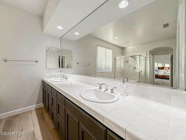 a bathroom with a bathtub and a sink