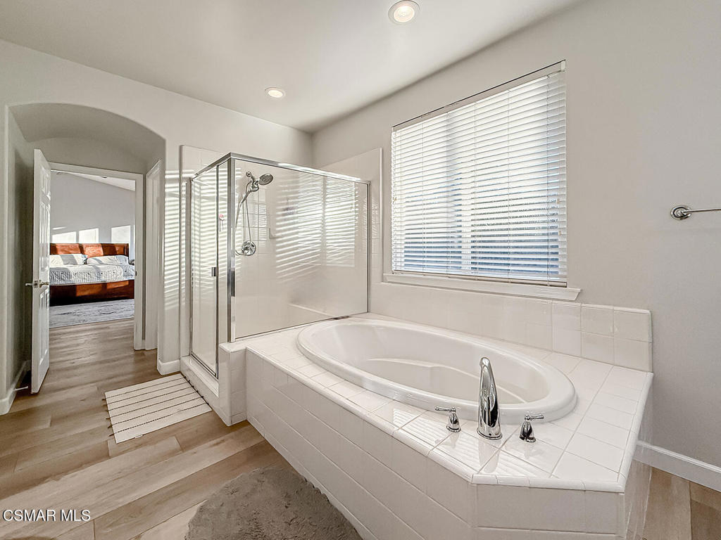 5816 Painted Pony Circle Simi Valley, CA 93063 - Photo 34 of 46 a bathroom with a bathtub and a sink