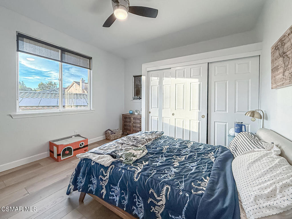 5816 Painted Pony Circle Simi Valley, CA 93063 - Photo 35 of 46 a bedroom with a bed and a painting on the wall