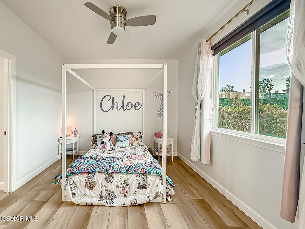 5816 Painted Pony Circle Simi Valley, CA 93063 - Photo 37 of 46 a bedroom with a bed and wooden floor