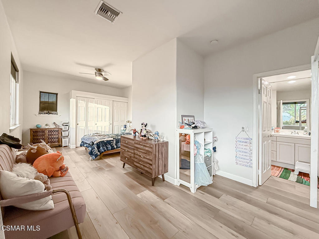 5816 Painted Pony Circle Simi Valley, CA 93063 - Photo 38 of 46 a living room with furniture and a wooden floor