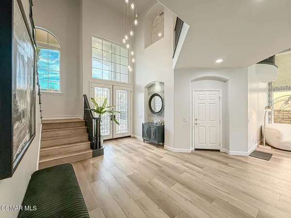 a view of outdoor space with wooden floor and windows