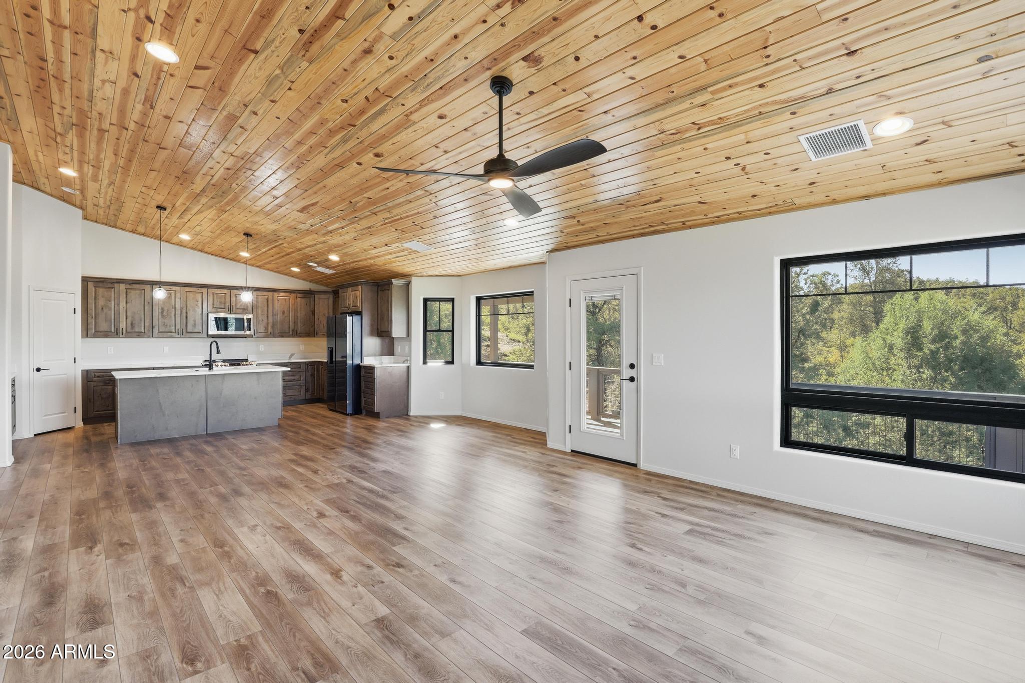 1908 East Starlight Pass Payson, AZ 85541 - Photo 18 of 30 a view of a kitchen with wooden floor and windows