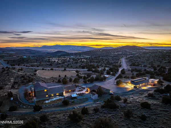 a view of a swimming pool and outside seating area