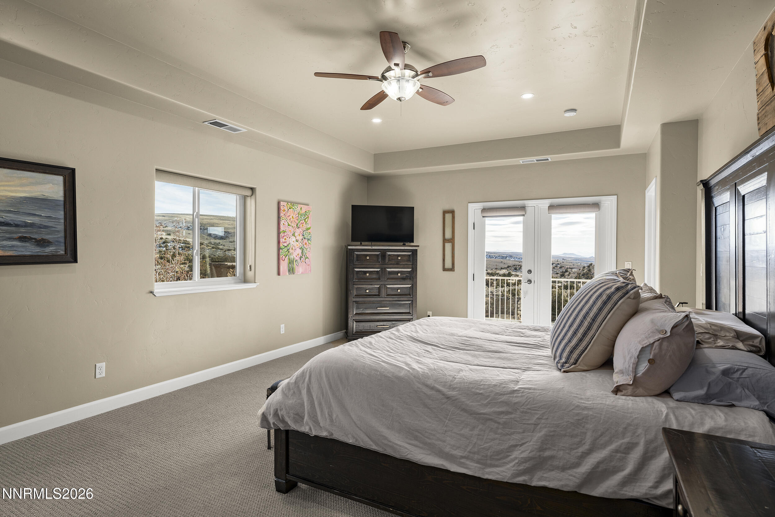 730 Encanto Drive Sparks, NV 89441 - Photo 24 of 87 a bedroom with a large bed and a tv