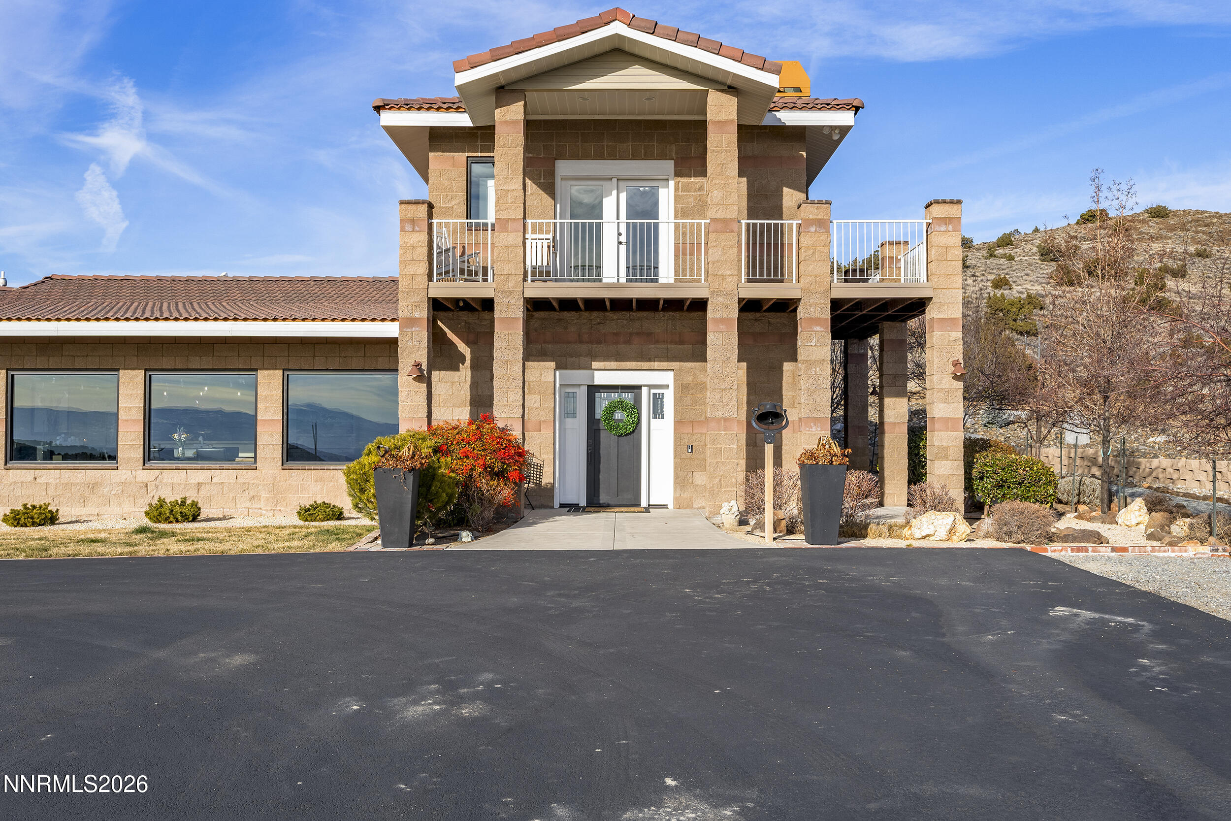 730 Encanto Drive Sparks, NV 89441 - Photo 30 of 87 a front view of a house with a large space and a car parked in front of it