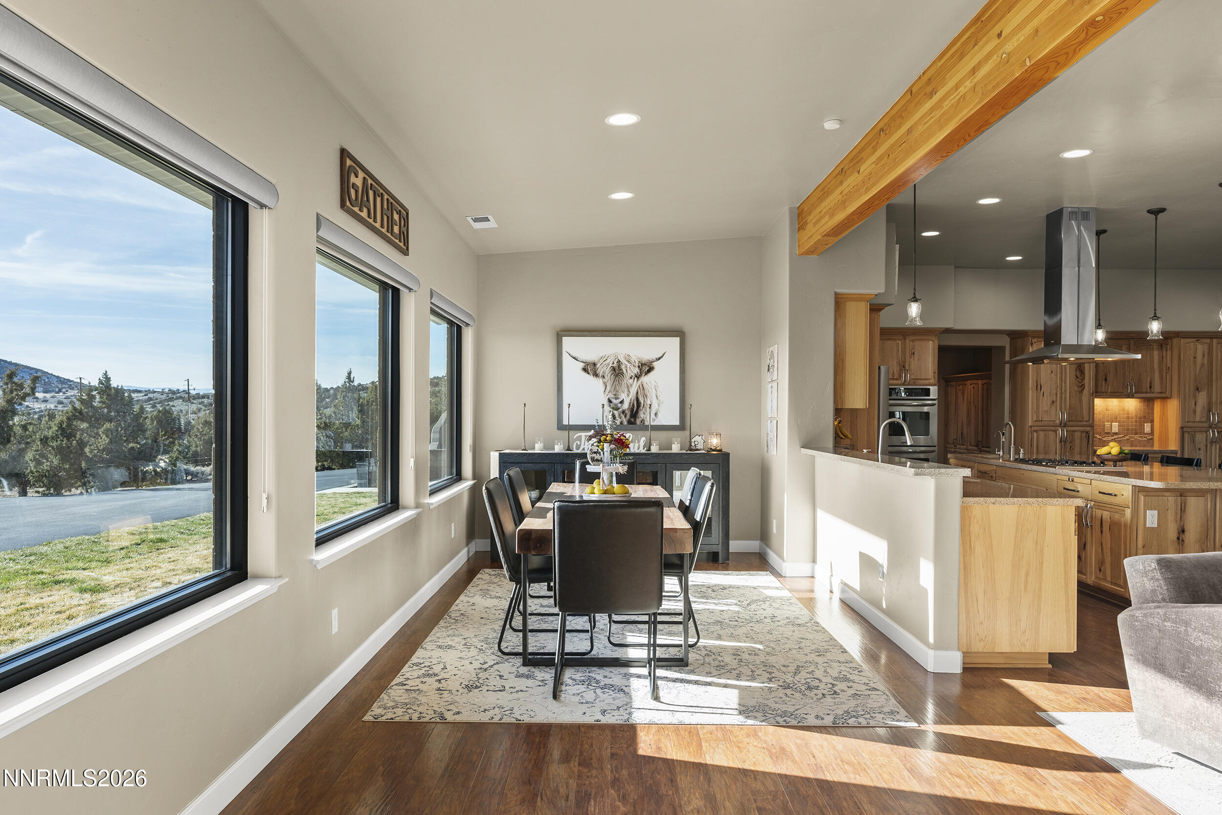 730 Encanto Drive Sparks, NV 89441 - Photo 35 of 87 a dining room with wooden floor and a floor to ceiling window