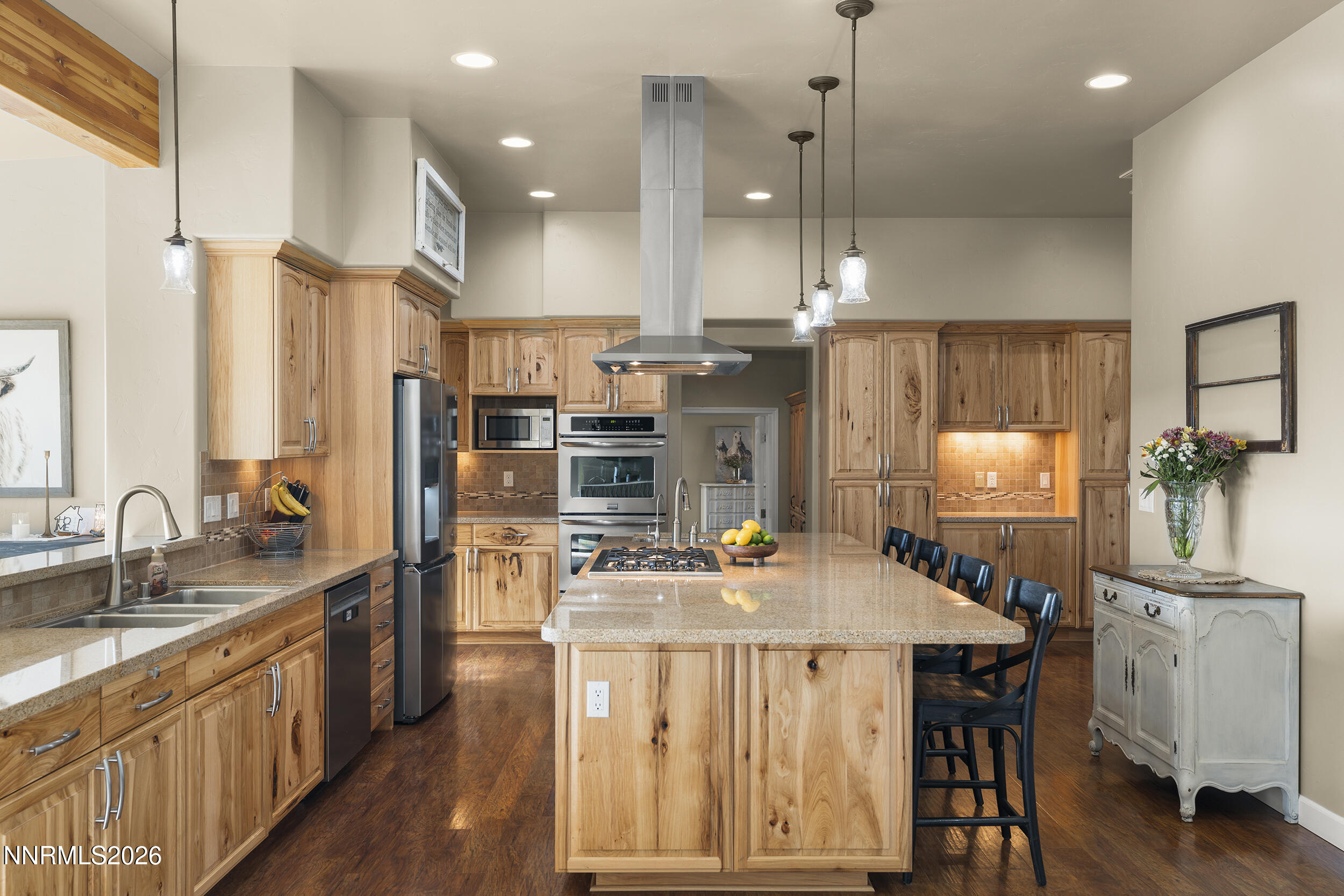 730 Encanto Drive Sparks, NV 89441 - Photo 39 of 87 a kitchen with stainless steel appliances kitchen island granite countertop a sink a refrigerator and a stove