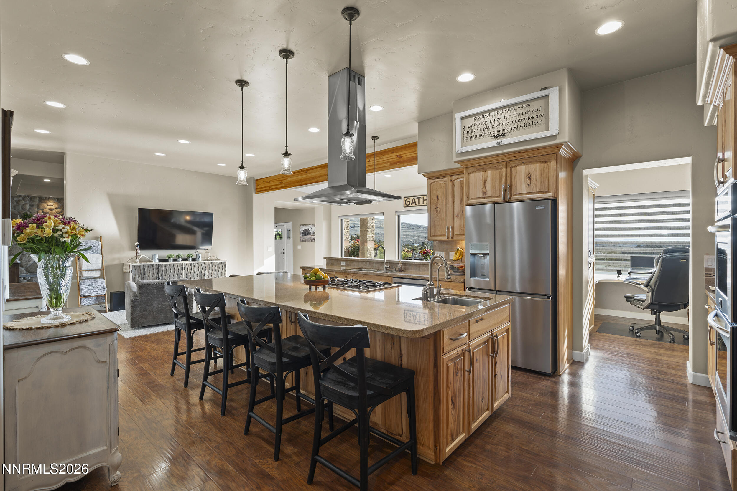 730 Encanto Drive Sparks, NV 89441 - Photo 40 of 87 a kitchen with stainless steel appliances a dining table chairs stove and white cabinets