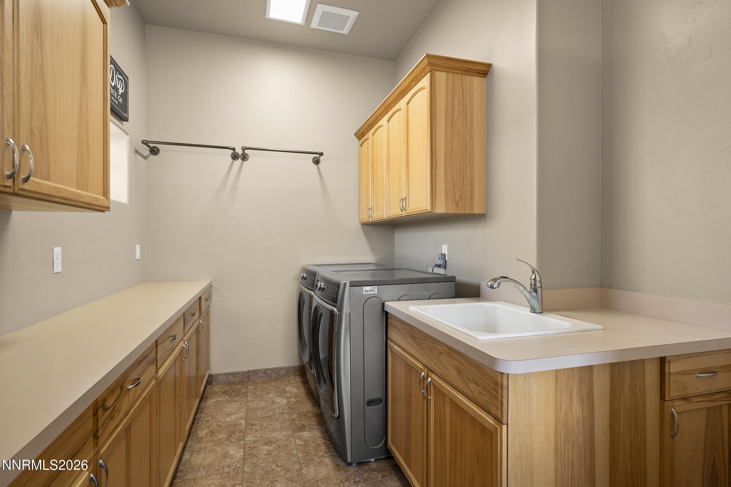 730 Encanto Drive Sparks, NV 89441 - Photo 44 of 87 a utility room with a sink a washer and dryer