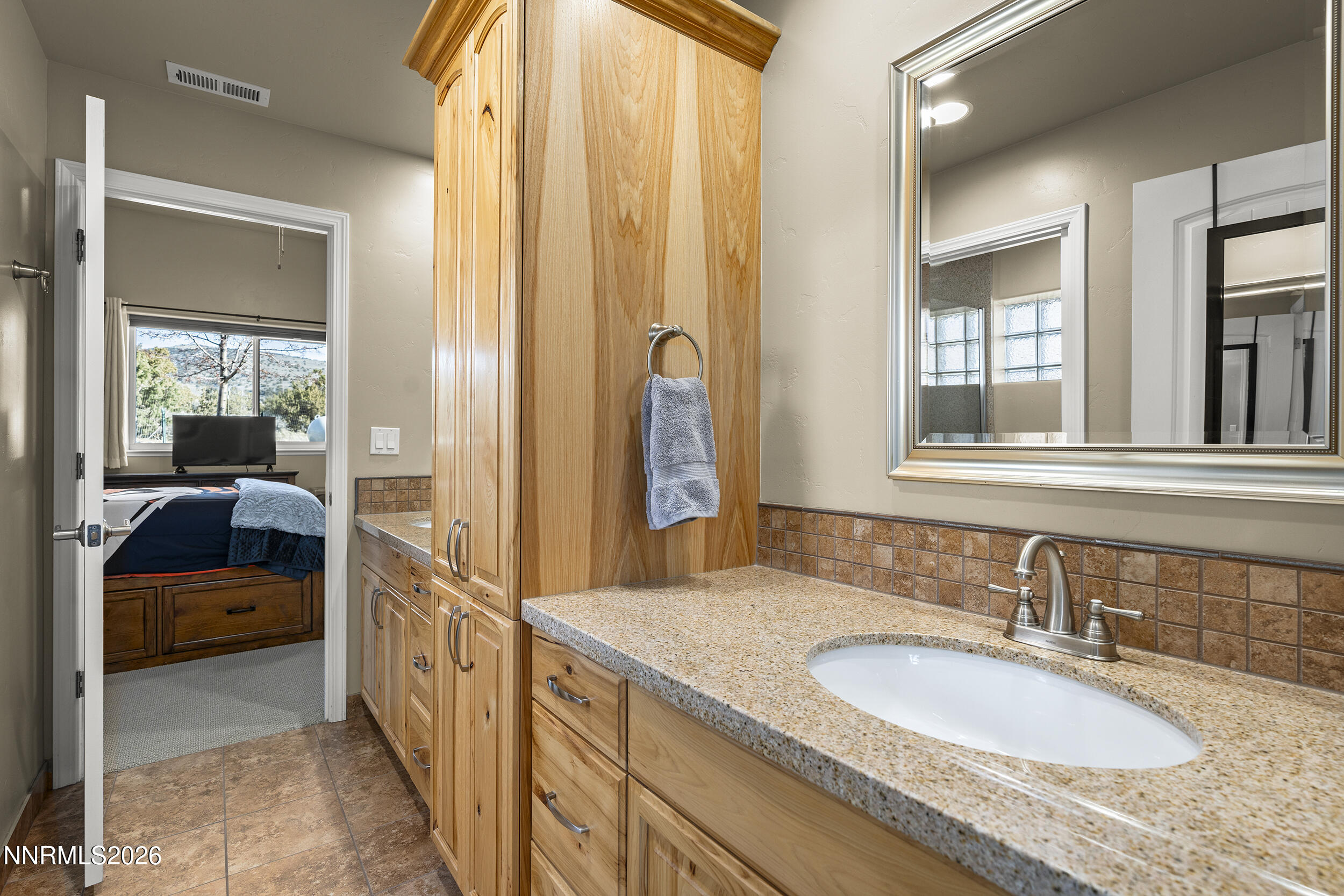 730 Encanto Drive Sparks, NV 89441 - Photo 46 of 87 a en suite bathroom with a sink and a mirror