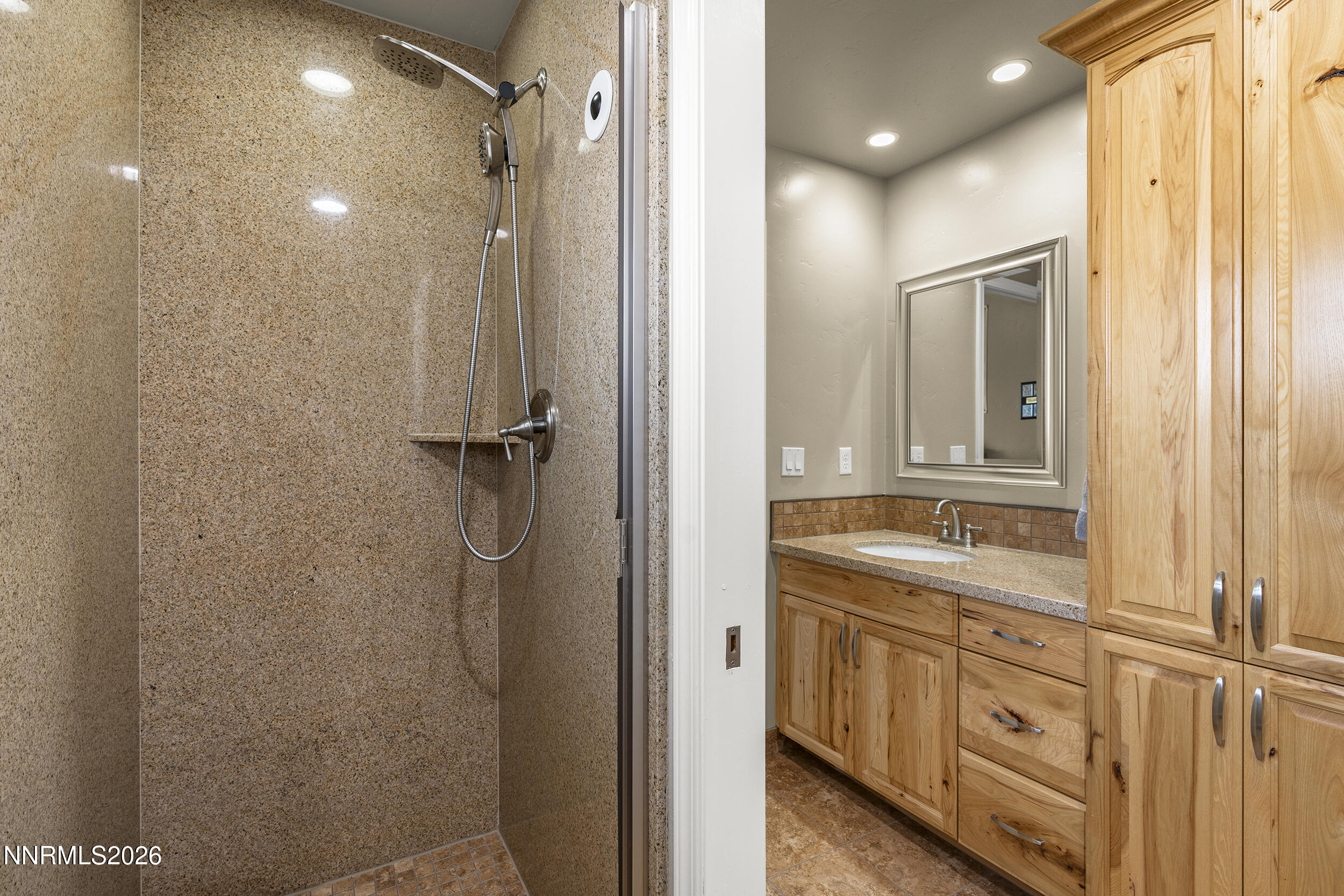 730 Encanto Drive Sparks, NV 89441 - Photo 49 of 87 a bathroom with a double vanity sink a mirror and a shower