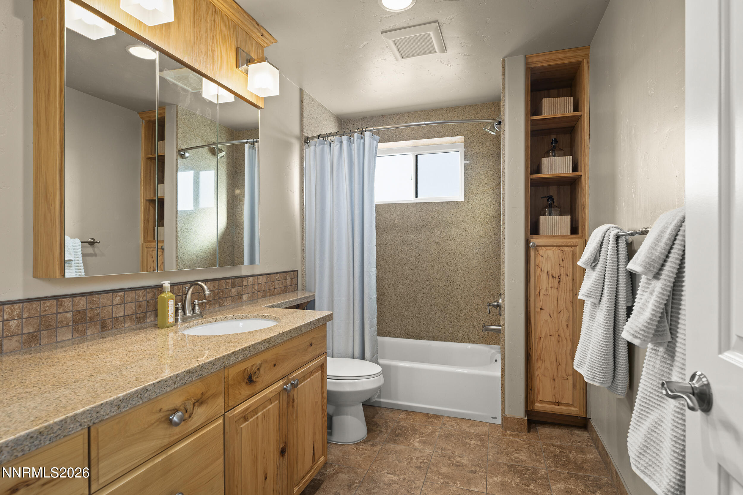 730 Encanto Drive Sparks, NV 89441 - Photo 53 of 87 a bathroom with a sink a toilet and a large mirror