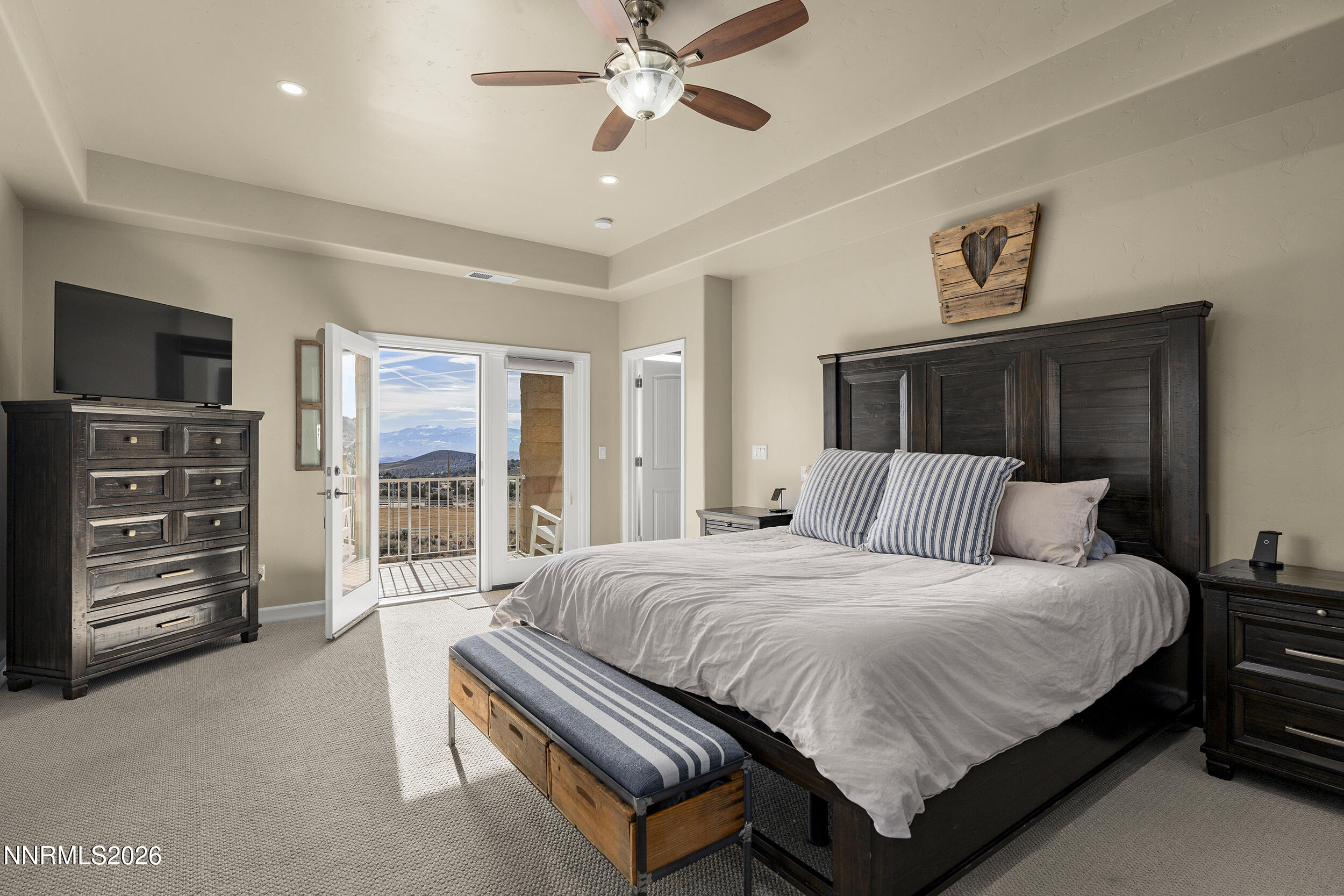 730 Encanto Drive Sparks, NV 89441 - Photo 6 of 87 a bedroom with a bed and a flat tv screen on dresser