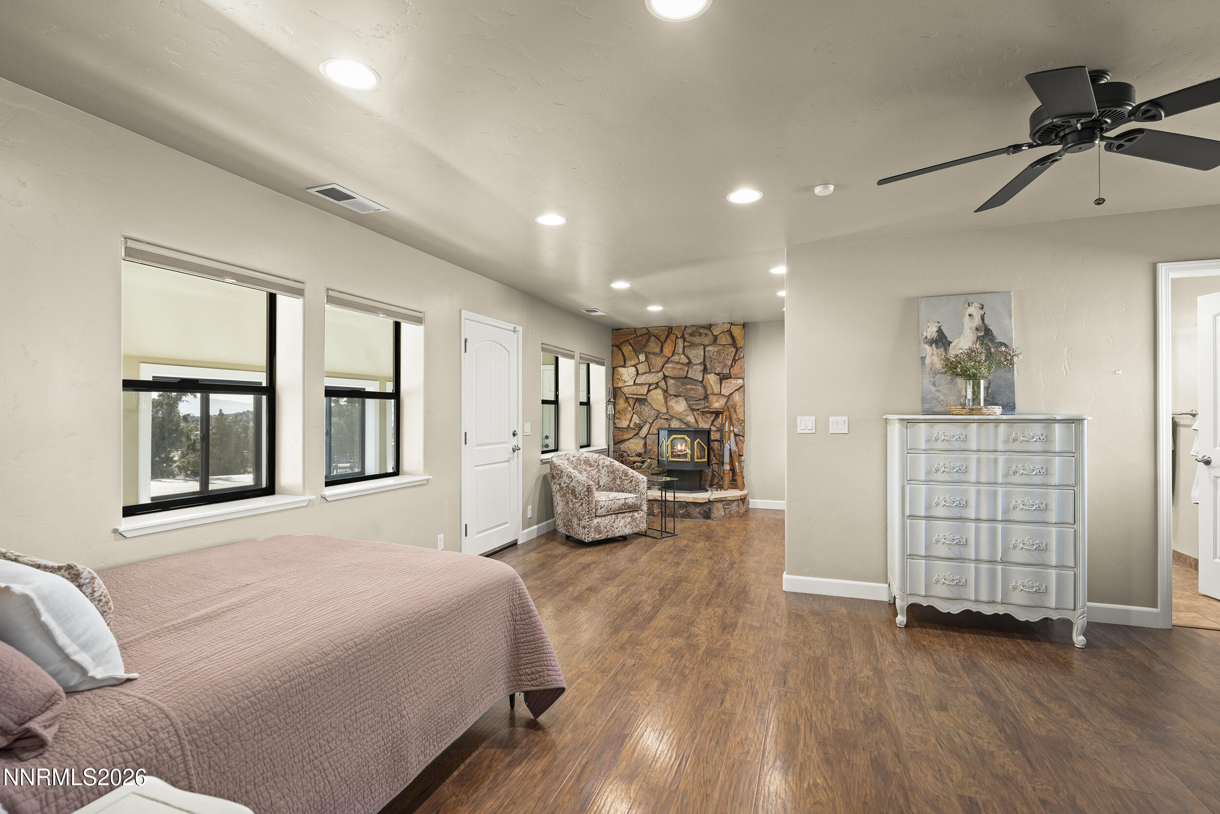 730 Encanto Drive Sparks, NV 89441 - Photo 8 of 87 a bedroom with a bed and wooden floor