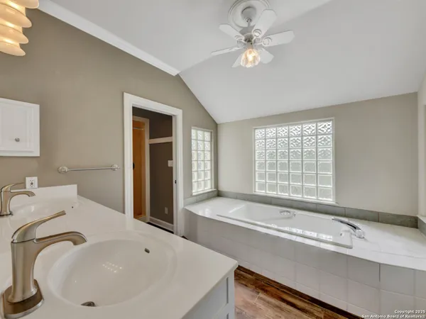 a view of an empty room with window and cabinet