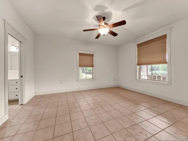 a view of small garden in the backyard with sitting area