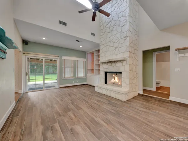 a kitchen with stainless steel appliances kitchen island granite countertop a refrigerator and a stove top oven