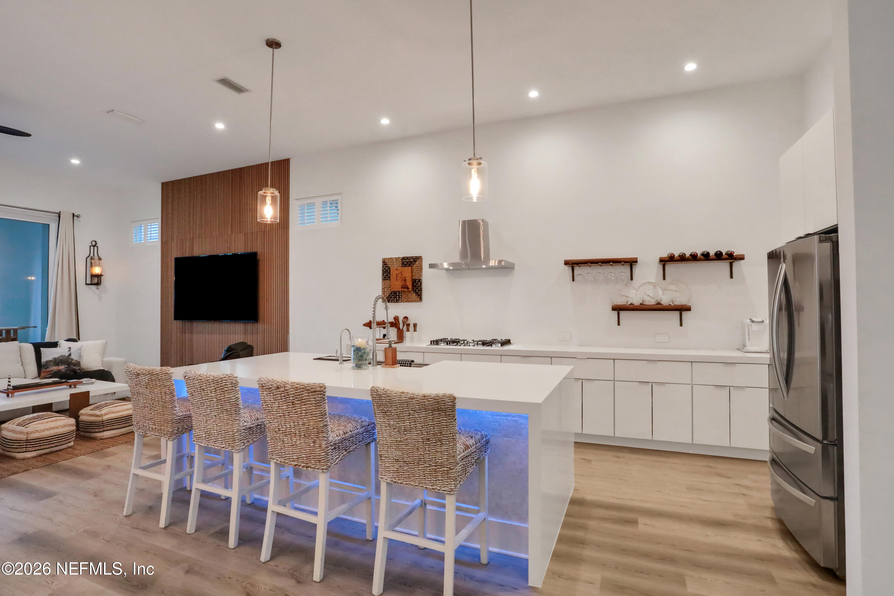 143 Washington Street St. Augustine, FL 32084 - Photo 12 of 76 a large kitchen with a table and chairs