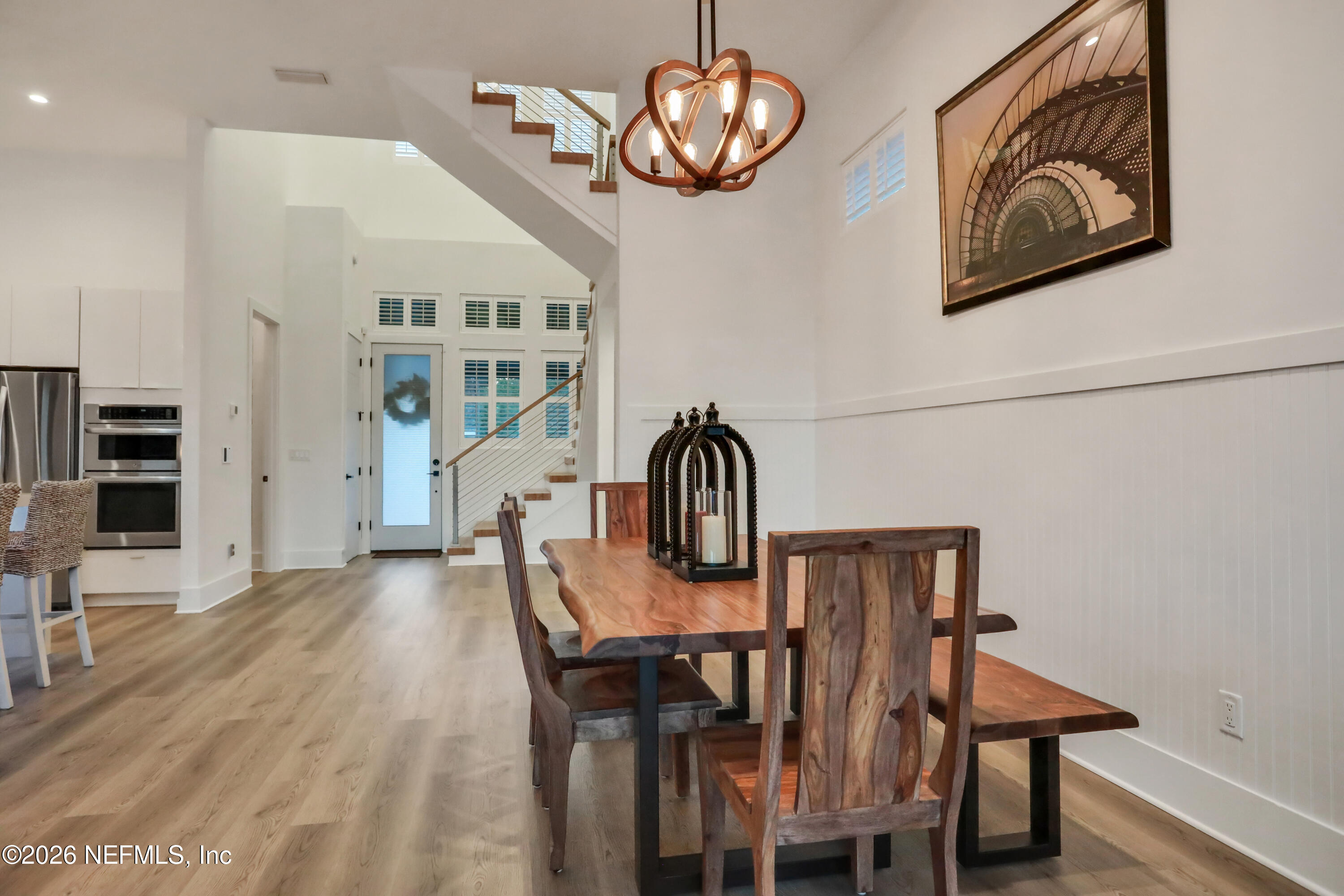 143 Washington Street St. Augustine, FL 32084 - Photo 24 of 76 a view of a dining room with furniture and wooden floor