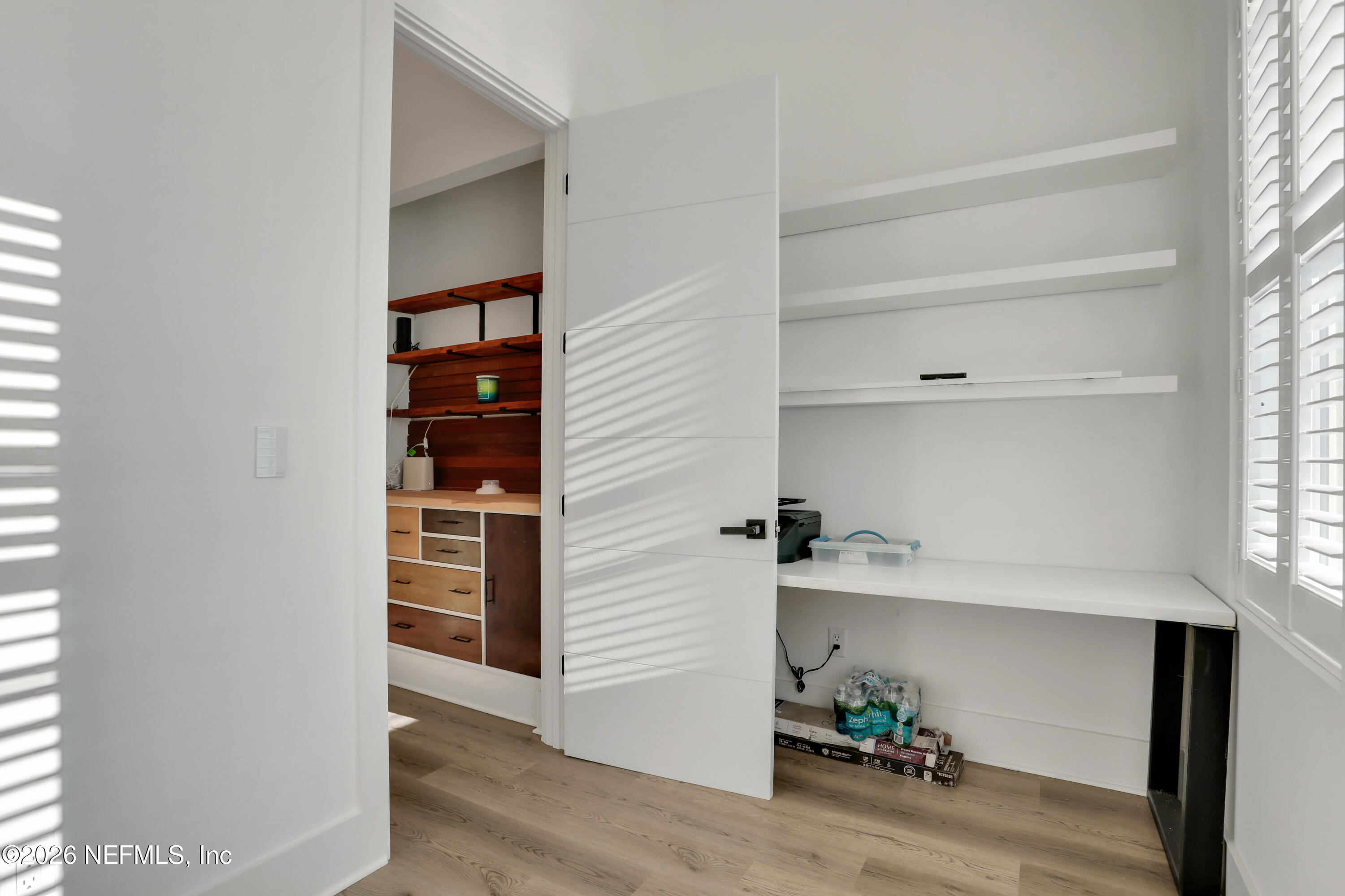 143 Washington Street St. Augustine, FL 32084 - Photo 42 of 76 a view of walk in closet with clothes and shoes