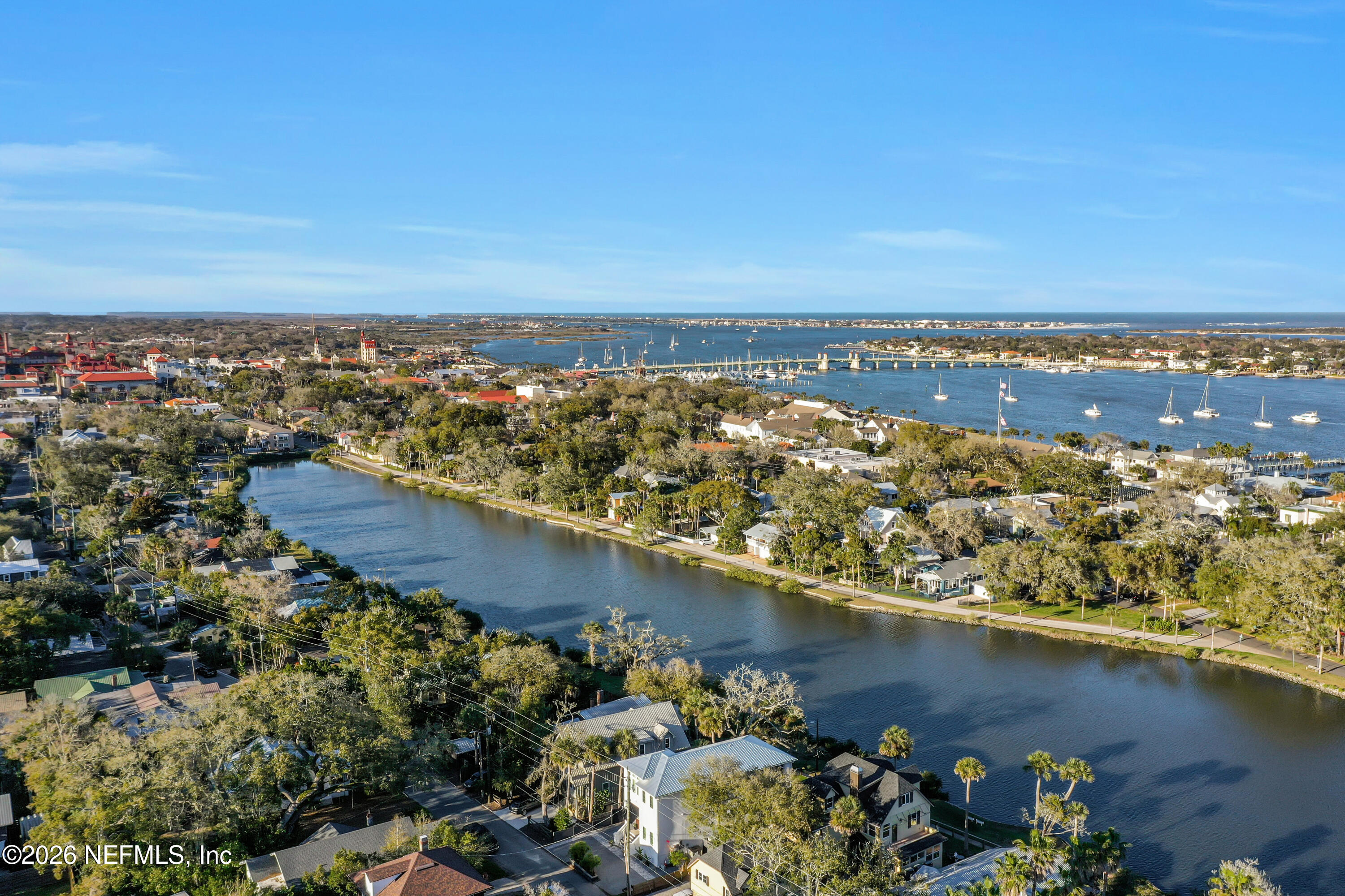 143 Washington Street St. Augustine, FL 32084 - Photo 72 of 76 an aerial view of a city with lots of residential buildings ocean and mountain view in back