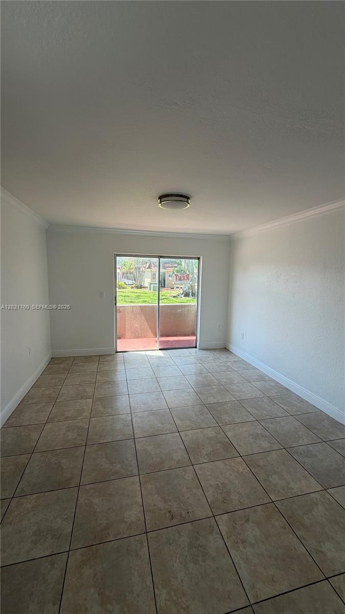 3901 Southwest 109th Avenue, Unit 4 Miami, FL 33165 - Photo 12 of 15 a view of an empty room with a window