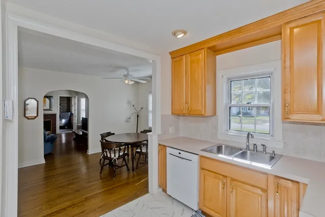 a kitchen with sink and cabinets