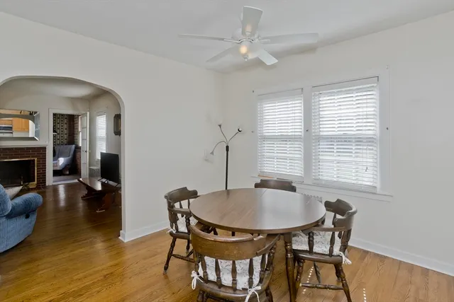 a dining room with furniture and window
