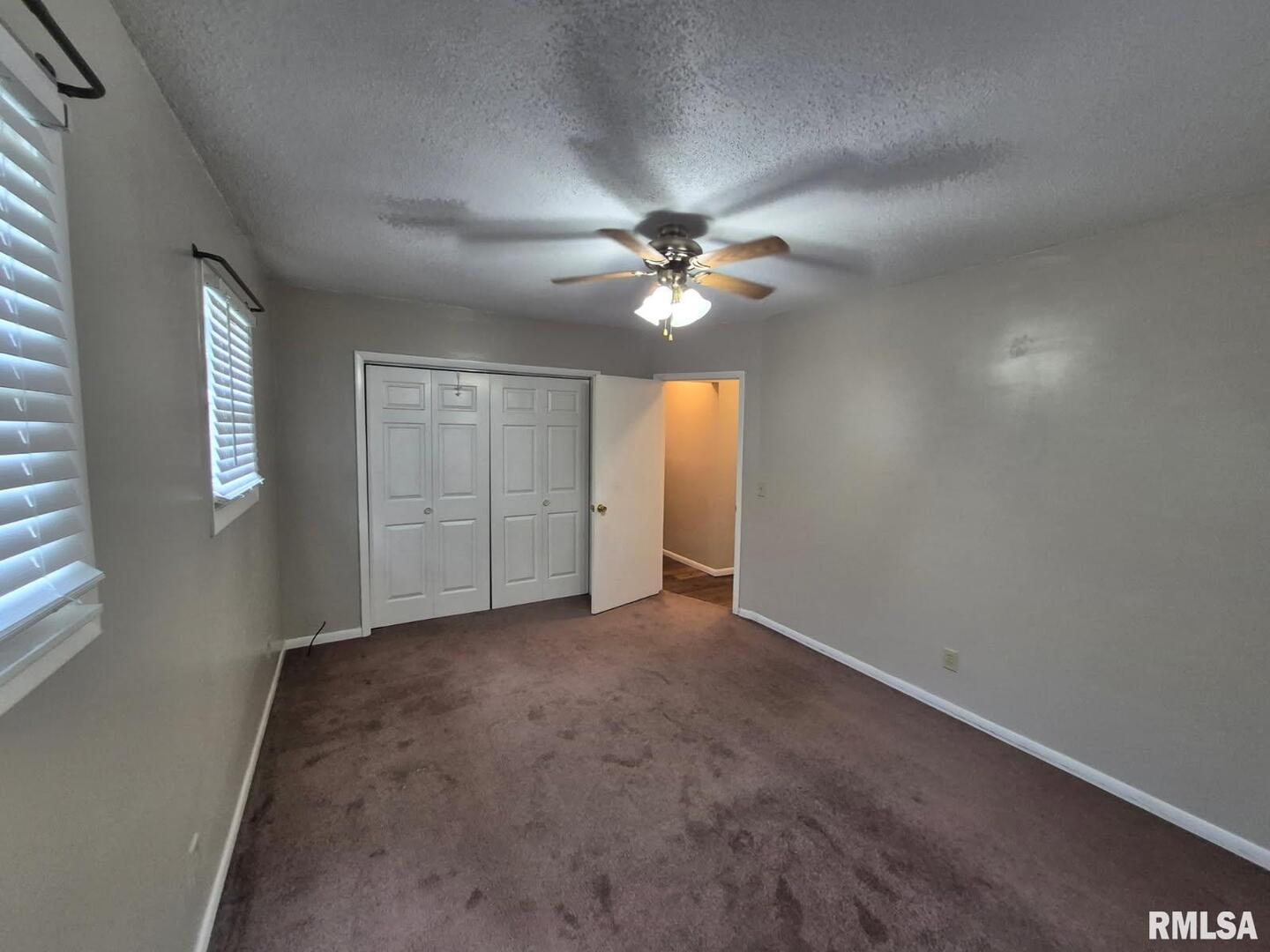 548 Edwards Street Kewanee, IL 61443 - Photo 13 of 18 an empty room with fan and windows