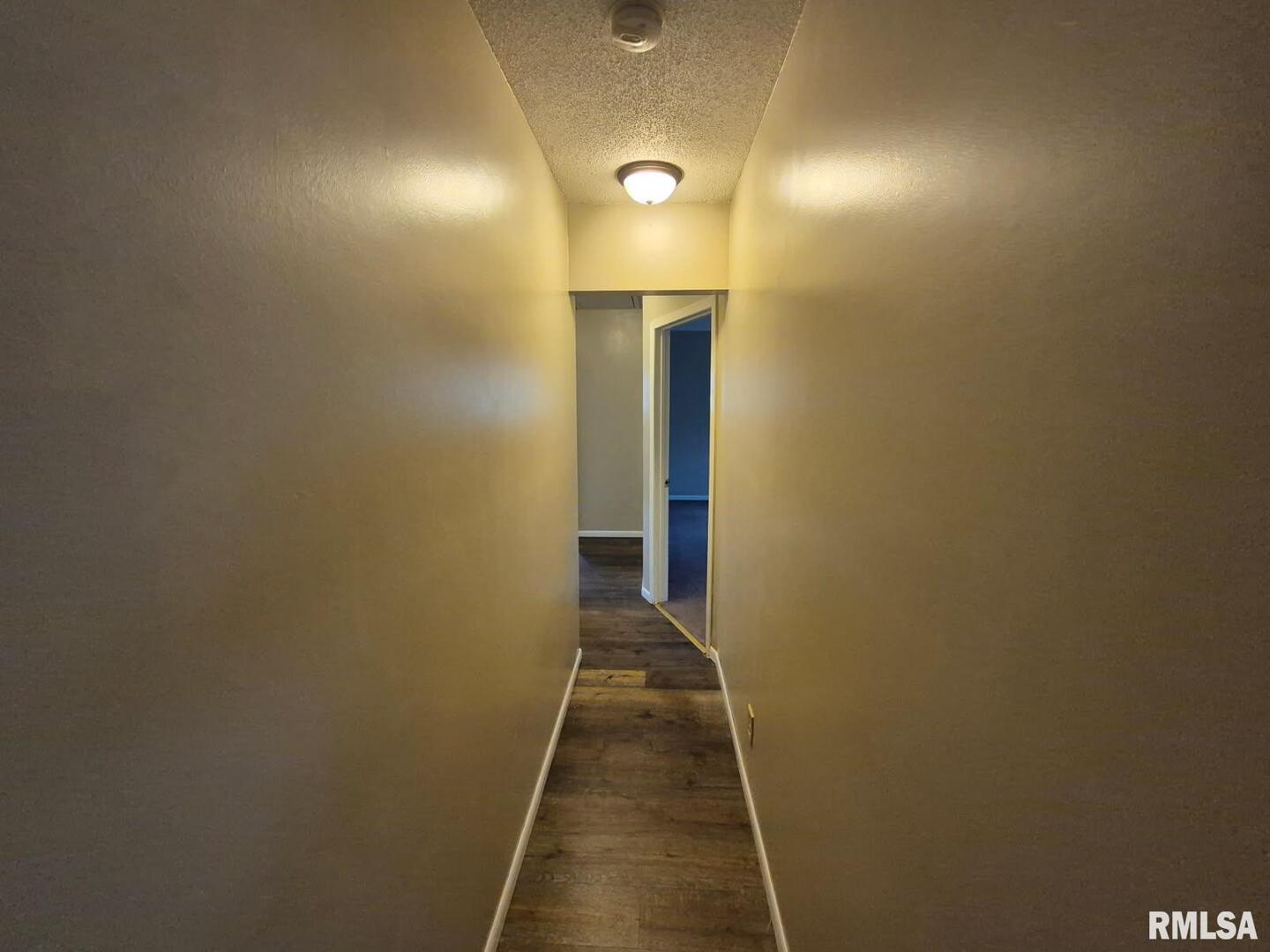548 Edwards Street Kewanee, IL 61443 - Photo 7 of 18 a view of a hallway with wooden floor