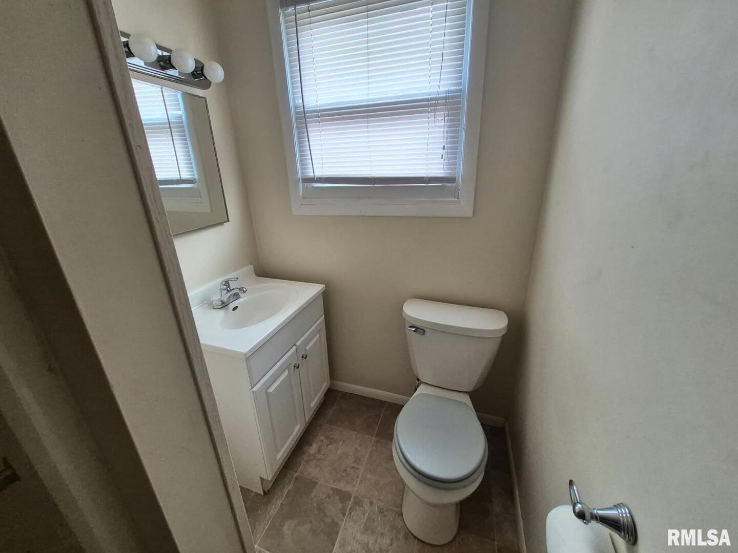 548 Edwards Street Kewanee, IL 61443 - Photo 10 of 18 a bathroom with a toilet sink and mirror
