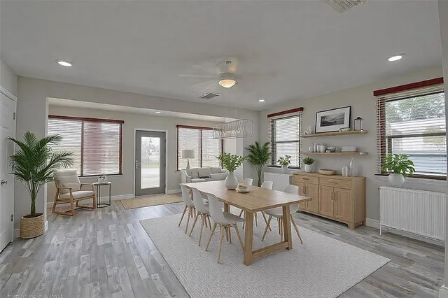 a kitchen with a table and chairs in it