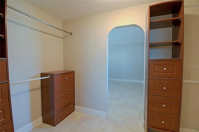 a room with a dresser and a mirror
